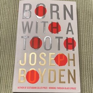 Born With a Tooth by Joseph Boyden — White Cover with Red and Gold Accents